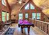 Loft area with futon and pool table
