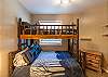 Secondary bedroom with a twin over double bunk bed 