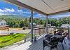 Front porch with seating and view of the mountains. 