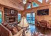 View of mountains through sliding glass doors in living room