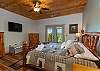 King log bedroom on lower level with French door access to the lower patio area. 
