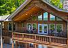 Large gabled upper deck, dual barrel table seating, and floor-to-ceiling windows.