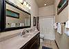 Ensuite bathroom located on the main floor off the primary bedroom. 