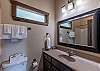 Ensuite bathroom off of the second bedroom on the main level. 