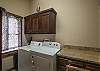 Equipped with a washer and dryer. 