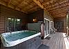 Relax in the hot tub located on the lower level deck. 