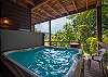 Relax in the hot tub that is covered on the lower level deck. 