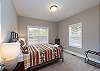 Second main level bedroom with a Queen bed. 