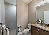 Full bathroom on the main level with a walk in shower. 