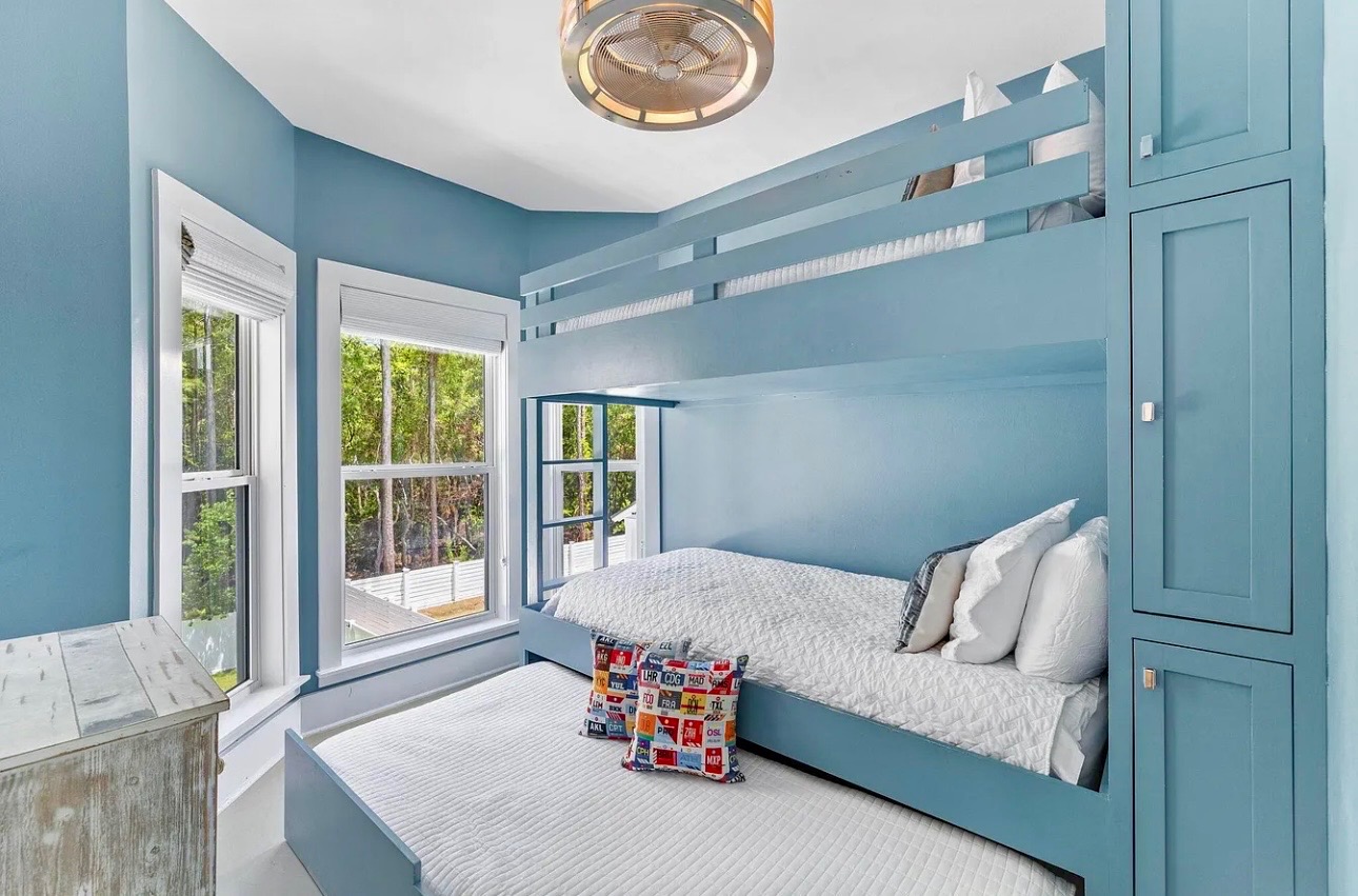 three twin beds with pool view