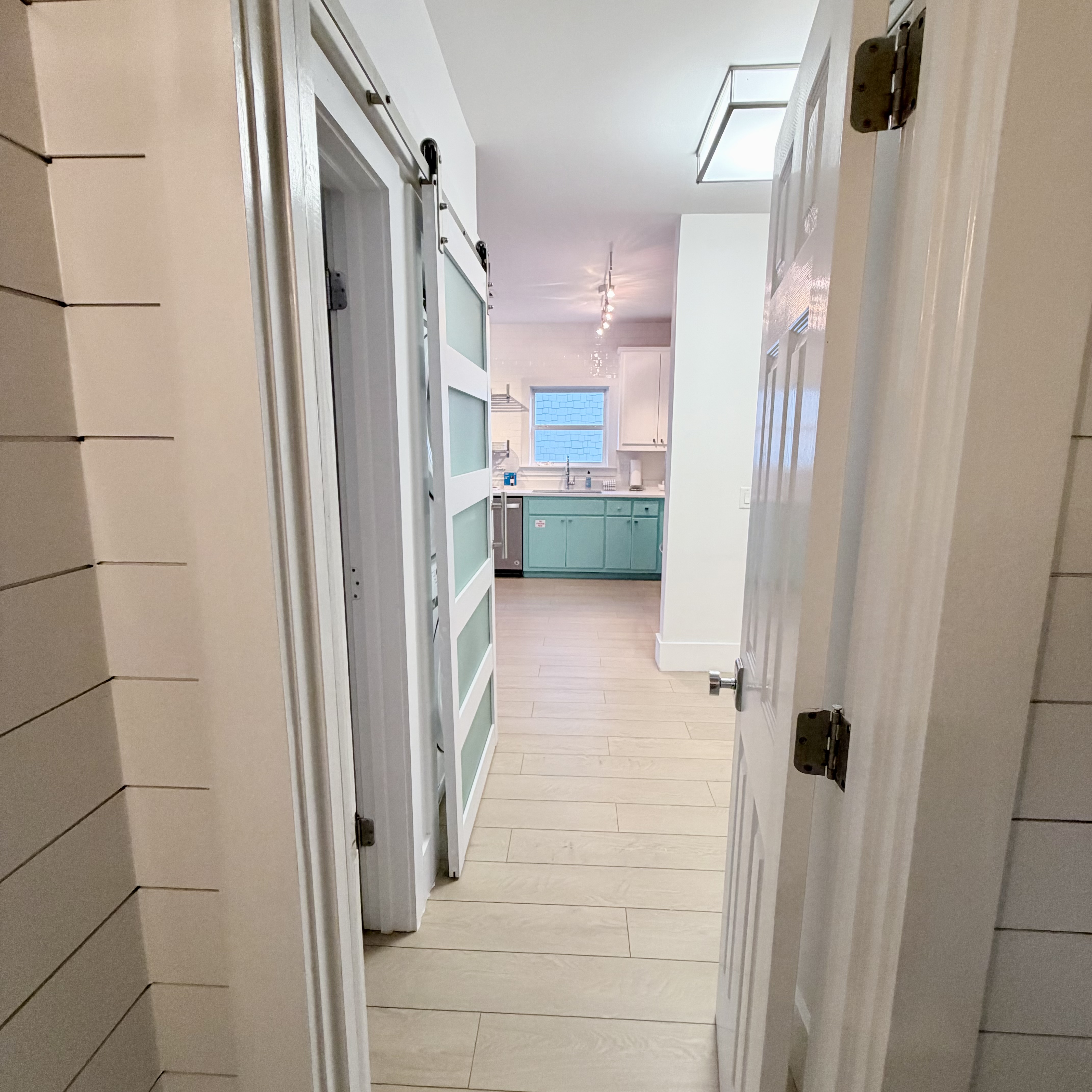 View from Guest bathroom downstairs looking into kitchen